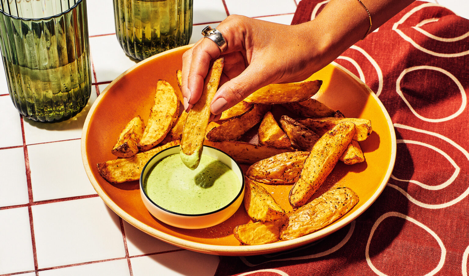 Potato wedges dipped in cilantro aioli.