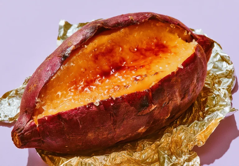 Yaki Imo, baked Murasaki sweet potato split open on foil
